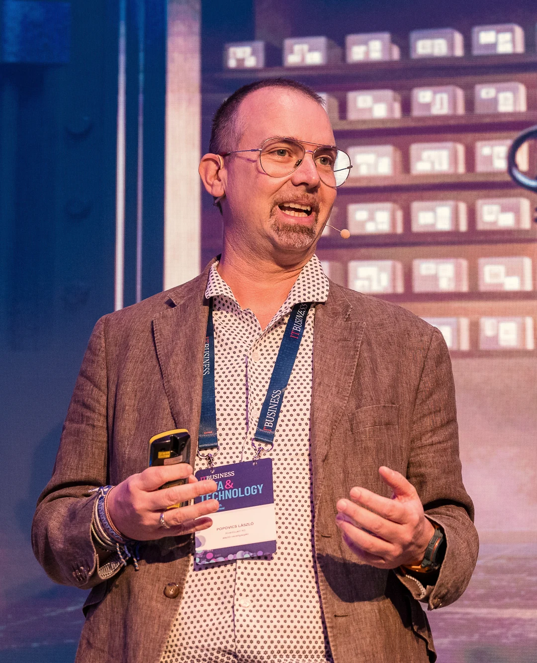 Laszlo Popovics speaking at a conference